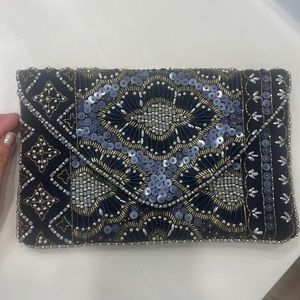 Lulus clutch with gold details and gold chain